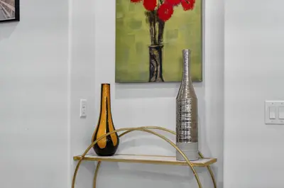 three vases sitting on a shelf next to a painting at New Construction - West End PCB - Gated Neighborhood - FLPCB63 in Panama City Beach