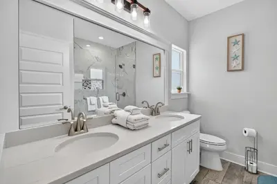 a white bathroom with a sink and a toilet at New Construction - West End PCB - Gated Neighborhood - FLPCB63 in Panama City Beach