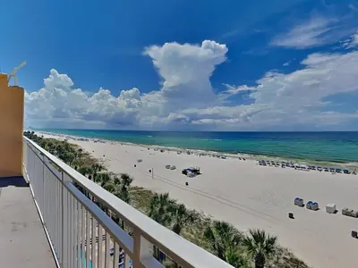 a view of the beach from the balcony of a resort at Sterling Reef #106 in Panama City Beach
