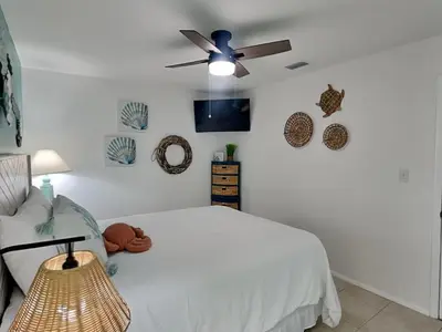 a bedroom with a bed and a ceiling fan at Endless Summer #A30 in Panama City Beach