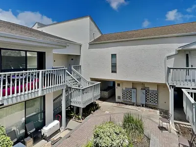 a apartment building with balconies and a patio at Endless Summer #A30 in Panama City Beach