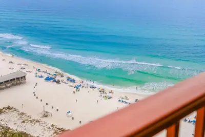 a view of a beach with a group of people at Beachfront, Ocean Views, Sleeps 6 , Hot tub in Panama City Beach