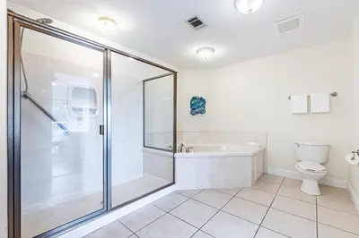a bathroom with a shower and a toilet at 402 Cassine Station - High Tide 30A in Santa Rosa Beach