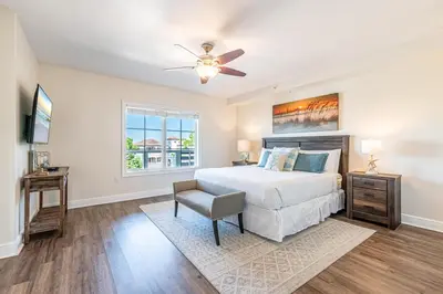 a bedroom with a bed and a ceiling fan at 402 Cassine Station - High Tide 30A in Santa Rosa Beach
