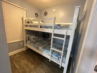 two white bunk beds in a room at SHORES of PANAMA 315 in Panama City Beach