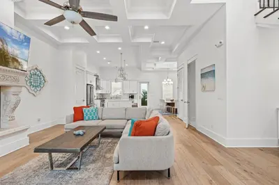 a living room with a couch and a table at Sea Esta Villa in Santa Rosa Beach