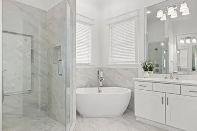 a white bathroom with a tub and a shower at Sea Esta Villa in Santa Rosa Beach