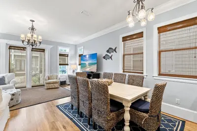 a dining room with a table and chairs at Big Kahuna Beach House in Santa Rosa Beach