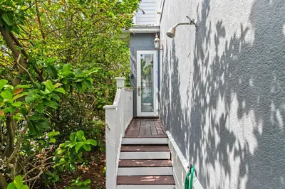 a stairway leading up to a door on a house at Big Kahuna Beach House in Santa Rosa Beach