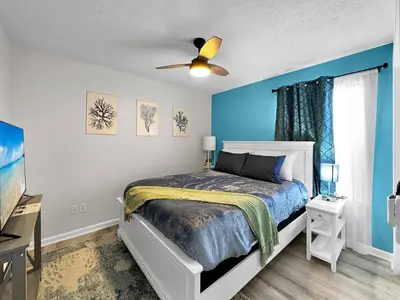 a bedroom with a bed and a ceiling fan at 1.2 mi to Beach | 15min to Pier Park | Pool Access in Panama City Beach