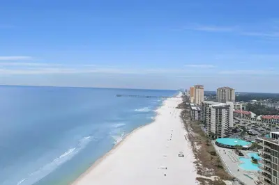 an aerial view of the beach in front of condos at 1.2 mi to Beach | 15min to Pier Park | Pool Access in Panama City Beach