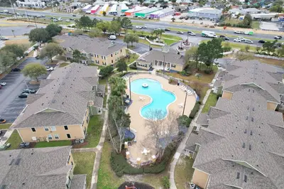 an aerial view of a pool in a residential neighborhood at Kid's Playground & Pool! | Spring Getaway! in Panama City Beach