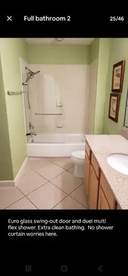 a bathroom with a shower and a toilet and a sink at Grandview East in Panama City Beach