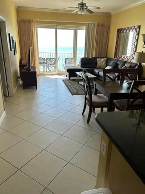 a living room with a couch and a table at Grandview East in Panama City Beach