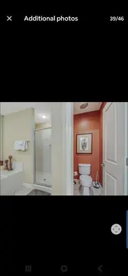 a bathroom with a white toilet and a shower at Grandview East in Panama City Beach