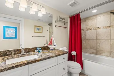 a bathroom with a sink and a toilet and a shower at It Doesn’t Get Any Better Than This! 2BR 2BA Sleeps 8 Beachfront! in Panama City Beach