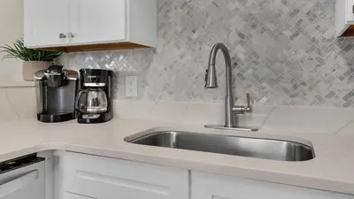 a kitchen with a sink and a coffee maker at Palms B4 in Santa Rosa Beach
