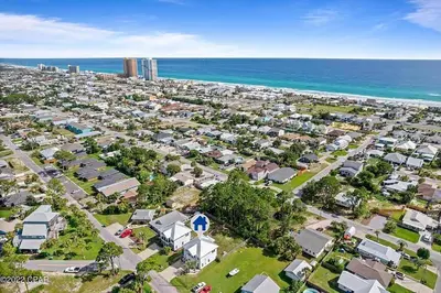 an aerial view of a city with houses and the ocean at Sunny Daze by Emerald Coast Retreats in Panama City Beach