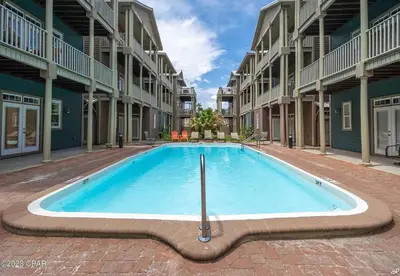a large swimming pool in the middle of a building at Blue Lagoon by Emerald Coast Retreats in Panama City Beach