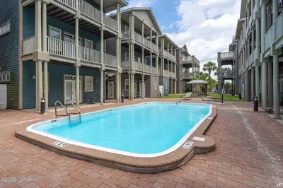 a swimming pool in the middle of a building at Blue Lagoon by Emerald Coast Retreats in Panama City Beach