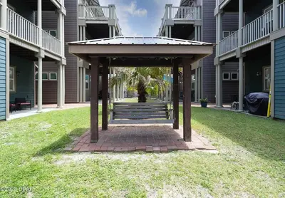 a gazebo in the middle of a yard at Blue Lagoon by Emerald Coast Retreats in Panama City Beach