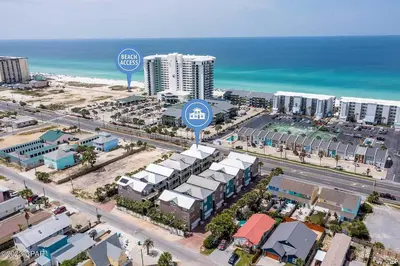 an aerial view of a city with buildings and the ocean at Blue Lagoon by Emerald Coast Retreats in Panama City Beach