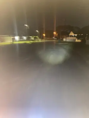 a blurry picture of a parking lot at night at Beach bum in Panama City Beach