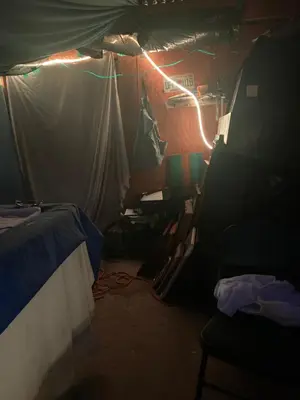 a dark room with a bed and lights in it at Beach bum in Panama City Beach