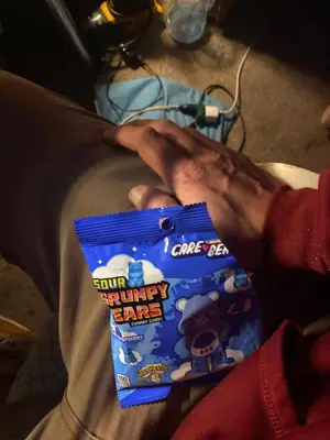 a person holding a bag of mickey ears candy at Beach bum in Panama City Beach