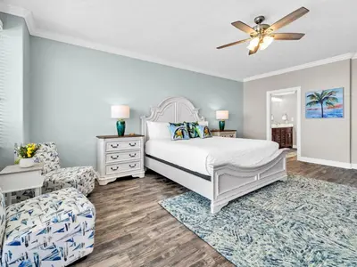 a bedroom with a bed and a ceiling fan at Hidden Dunes 1705 in Panama City Beach
