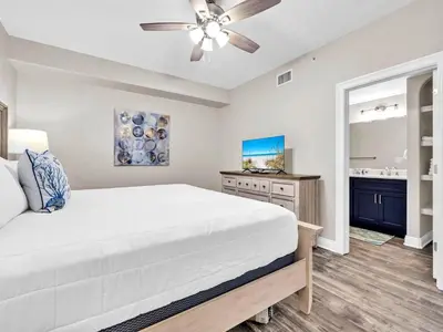 a bedroom with a bed and a ceiling fan at Hidden Dunes 1705 in Panama City Beach
