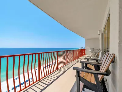 a balcony with two chairs and the beach at Hidden Dunes 1705 in Panama City Beach