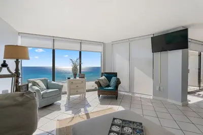 a living room with a view of the ocean at 1007 Edgewater T1 Beach Resort in Panama City Beach