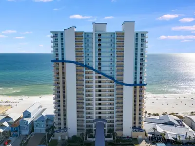 a tall building on the beach next to the ocean at 1202 Seychelles in Panama City Beach