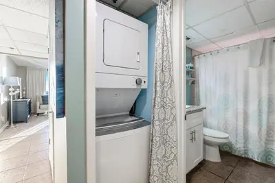 a bathroom with a toilet and a sink at 1107 Edgewater T3 Beach Resort in Panama City Beach
