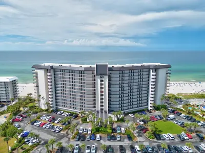 an aerial view of a large building with a parking lot at 1107 Edgewater T3 Beach Resort in Panama City Beach