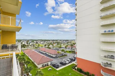 a view from the balcony of a building with a parking lot at 1105 Sterling Beach in Panama City Beach