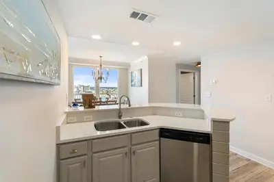 a kitchen with a sink and a window at 1209 Seychelles in Panama City Beach