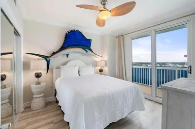 a bedroom with a bed and a ceiling fan at 1209 Seychelles in Panama City Beach