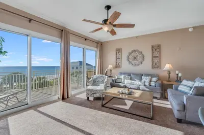 a living room with a view of the ocean at 305 Sterling Beach in Panama City Beach