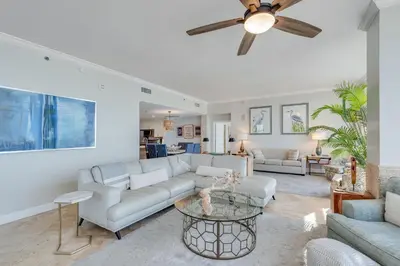 a living room with a couch and a ceiling fan at 607 Sterling Beach in Panama City Beach