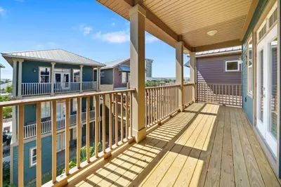 a front porch of a home with wooden decks at Sunset Serenity in Panama City Beach