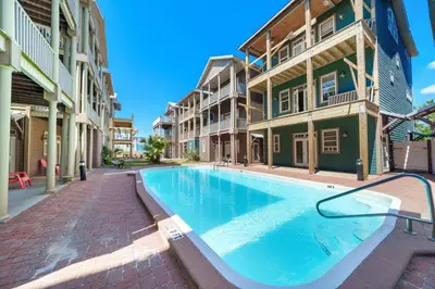 a swimming pool in the middle of a building at Sunset Serenity in Panama City Beach