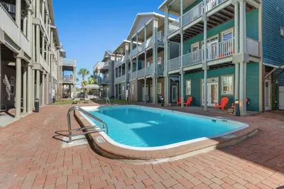a swimming pool in the middle of a building at Sunset Serenity in Panama City Beach