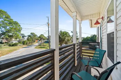 a porch with chairs and a view of a street at Hilltop Manor in Panama City Beach