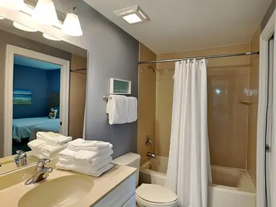 a bathroom with a sink and a toilet and a shower at Boardwalk #1602 in Panama City Beach