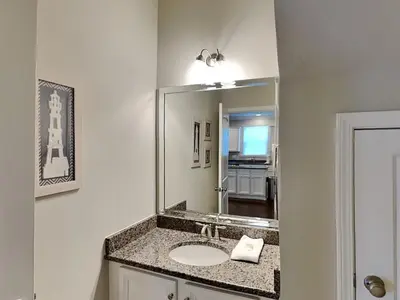 a bathroom with a sink and a mirror at Southern Charm in Inlet Beach