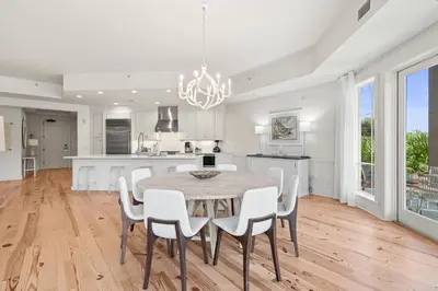 a kitchen and dining room with a table and chairs at 37 Compass Point South #107 in Inlet Beach