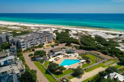 an aerial view of the resort and the beach at 37 Compass Point South #107 in Inlet Beach