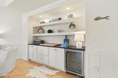 a kitchen with white cabinets and a counter at 37 Compass Point South #107 in Inlet Beach